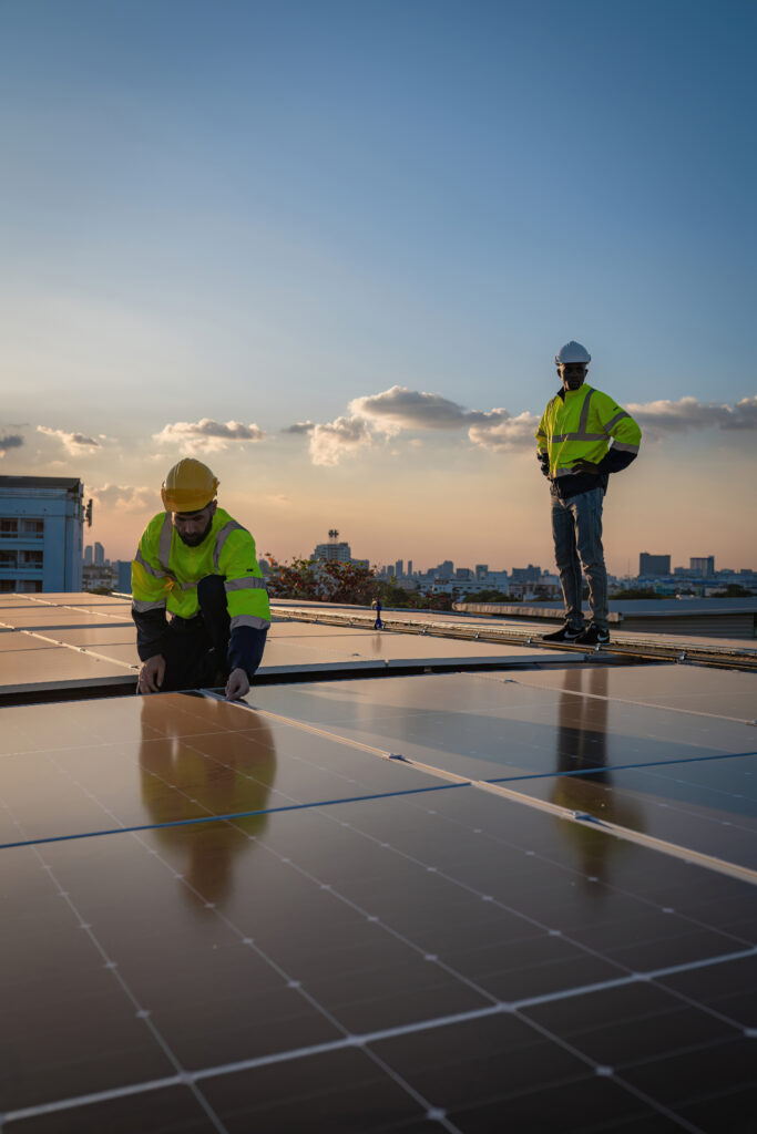 Engineer service check installation solar cell on the roof of factory