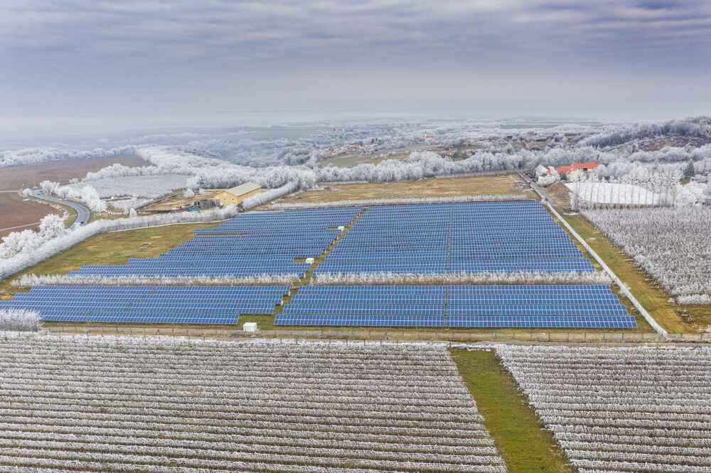 Winery and vineyard in winter with large ground-mounted solar panels